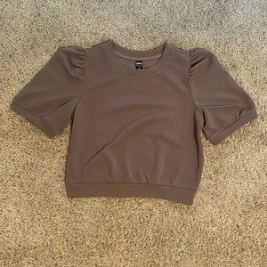 This beautiful blouse brown top is sure to make a statement!